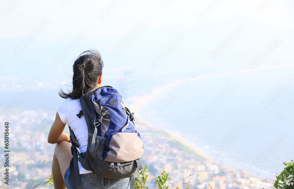hiking woman enjoy the beautiful view at mountain peak hiking woman enjoy the beautiful view at mountain peak
