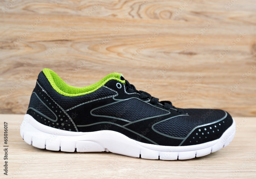 Black sneaker with green trim Black sneaker with green trim