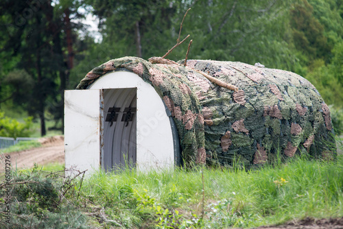 military building in wood camouflage
