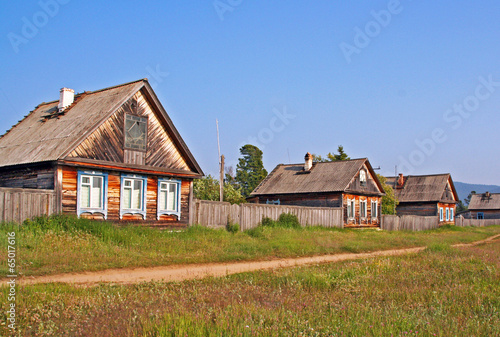 Row of traditional wooden houses in a remote village in Russian