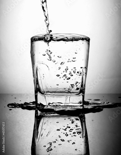 pouring water to glass