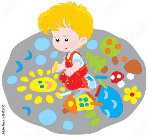Child drawing on the pavement