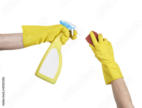 Cleaning surface in bright yellow gloves with sponge and cleanin