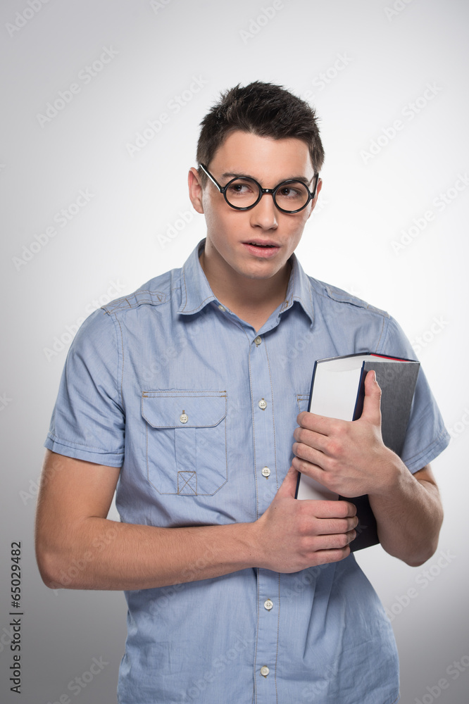handsome young man standing and looking. handsome young man standing and looking.