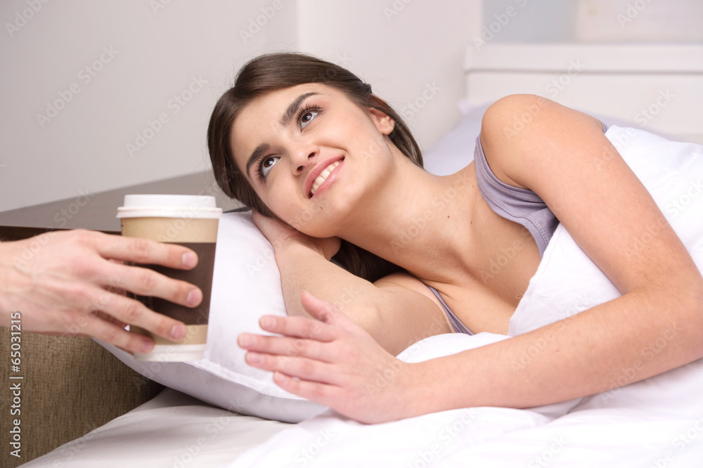 beautiful young girl waking in bed. beautiful young girl waking in bed.