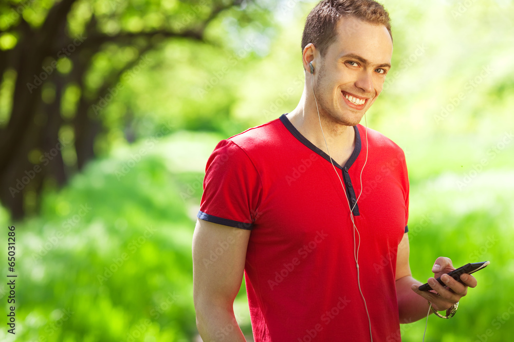 Gadget freak concept. Muscular man with smartphone Gadget freak concept. Muscular man with smartphone