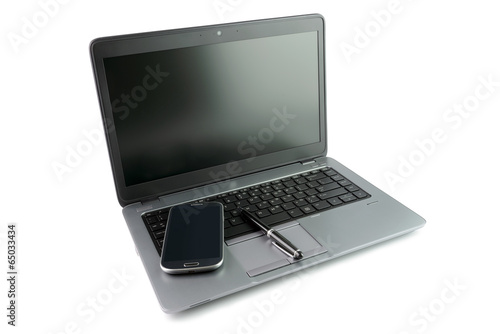 Fototapeta Naklejka Na Ścianę i Meble -  Mobile phone and pen on laptop