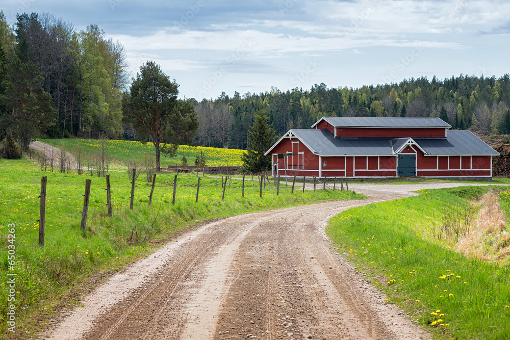 Fototapeta premium Red barn in scenic rural landscape