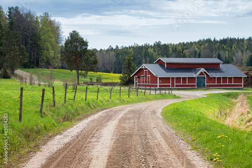 Red barn in scenic rural landscape