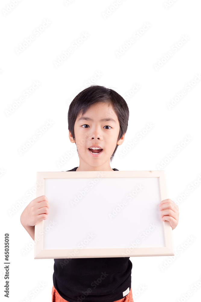 Portrait of a little boy holding a whiteboard over white backgro Portrait of a little boy holding a whiteboard over white backgro
