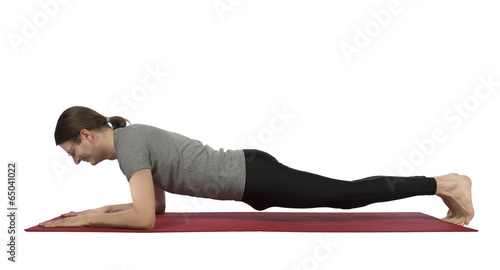 Man doing forearm plank pose in yoga