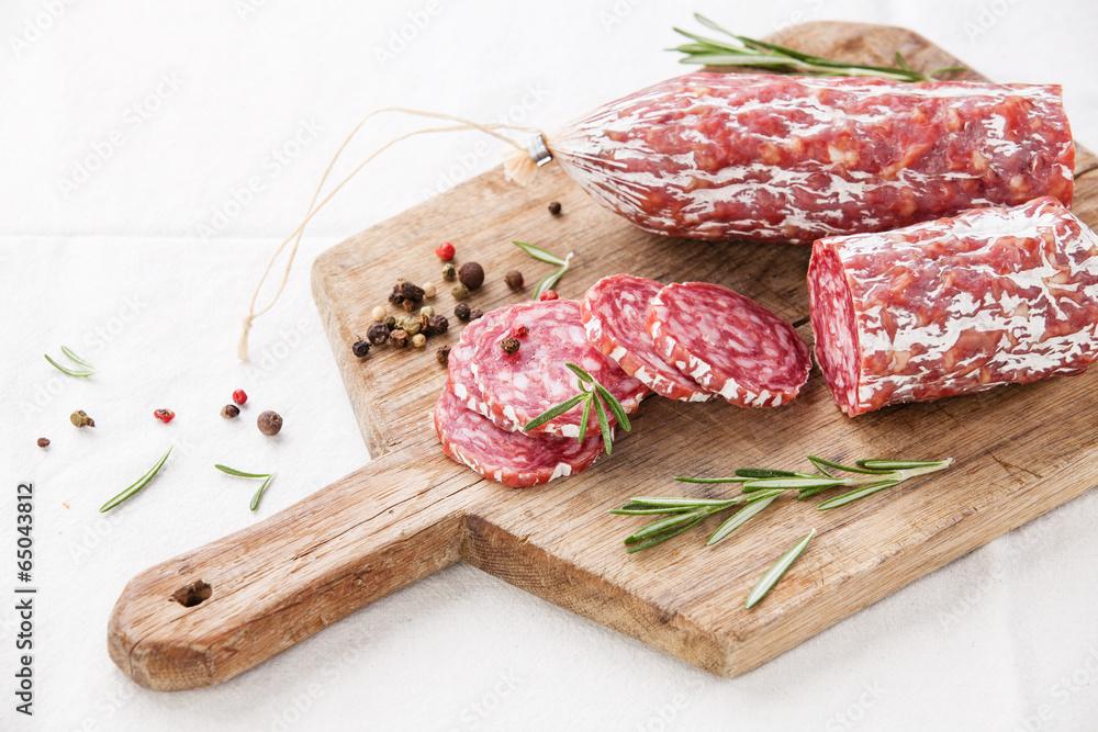 Italian salami on wooden cutting Board Italian salami on wooden cutting Board