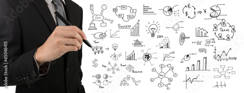 Business man hand drawing success graph over white background