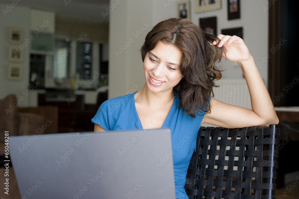 girl working with lab top in house girl working with lab top in house