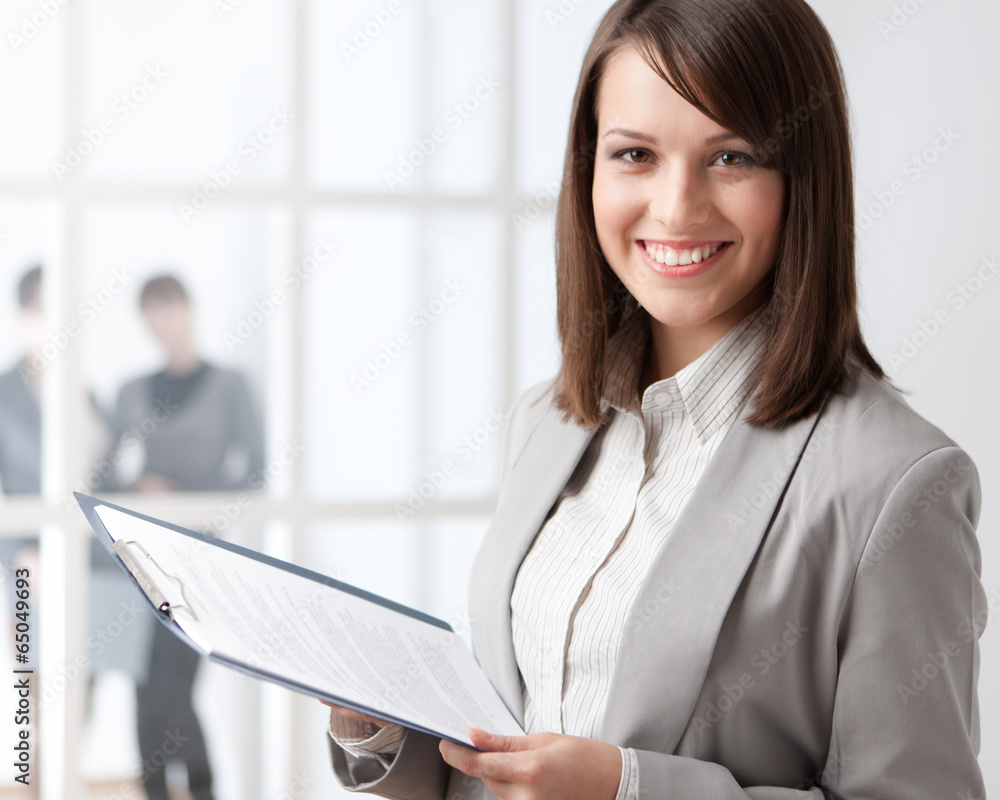 Manager with tablet on the glass wall background Manager with tablet on the glass wall background