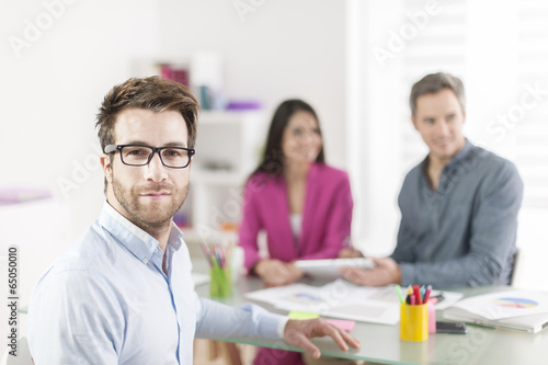 Portrait of a smiling businessman in meeting