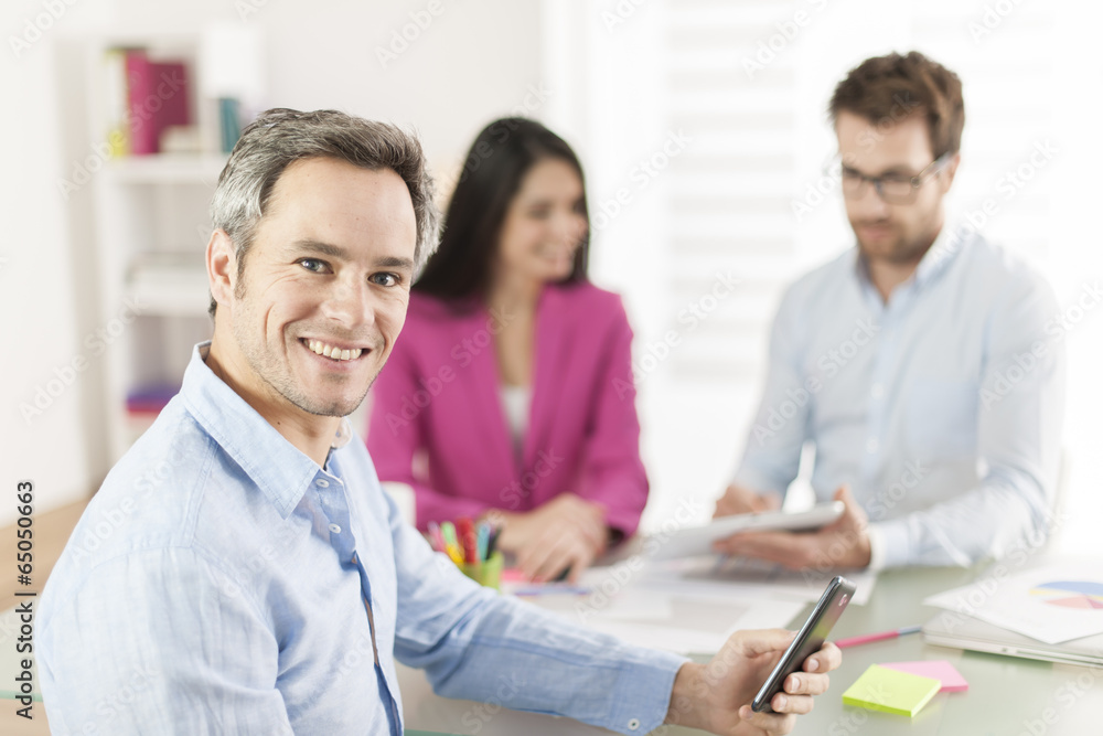 Portrait of a smiling senior businessman in meeting Portrait of a smiling senior businessman in meeting