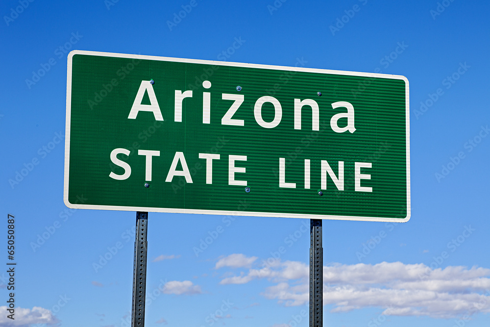 A Green Arizona State Line Road Sign