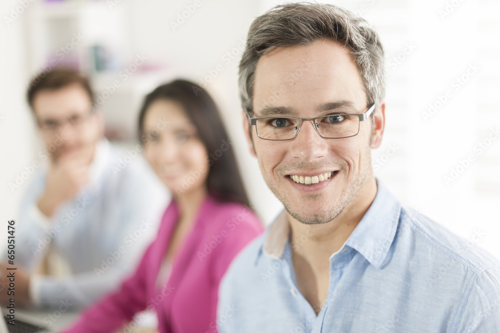 Portrait of a smiling senior businessman  in meeting