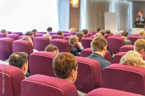 people sitting rear at the business conference