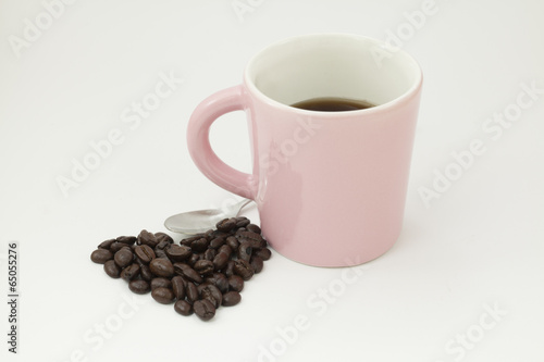 Coffee beans and a cup of coffee