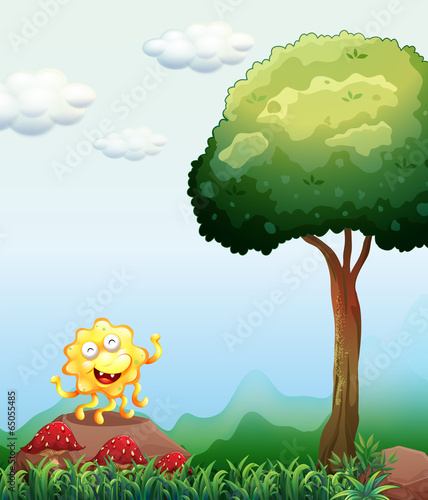 A happy monster above the rock near the mushrooms