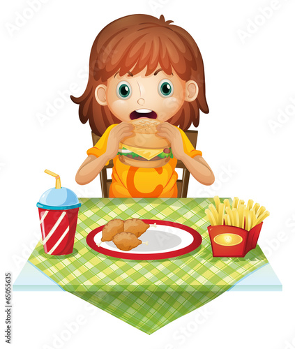 A hungry little girl eating