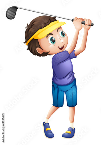 A young boy golfing
