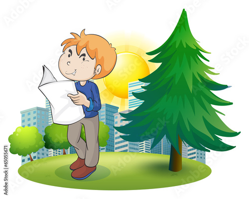 A man reading newspaper near the pine tree
