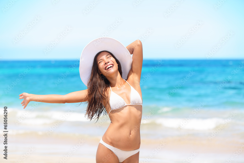 Woman on beach enjoying sun happy on travel Woman on beach enjoying sun happy on travel