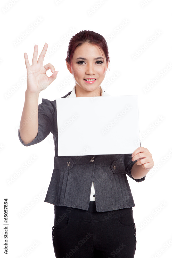 Asian businesswoman show a blank sign and OK sign Asian businesswoman show a blank sign and OK sign