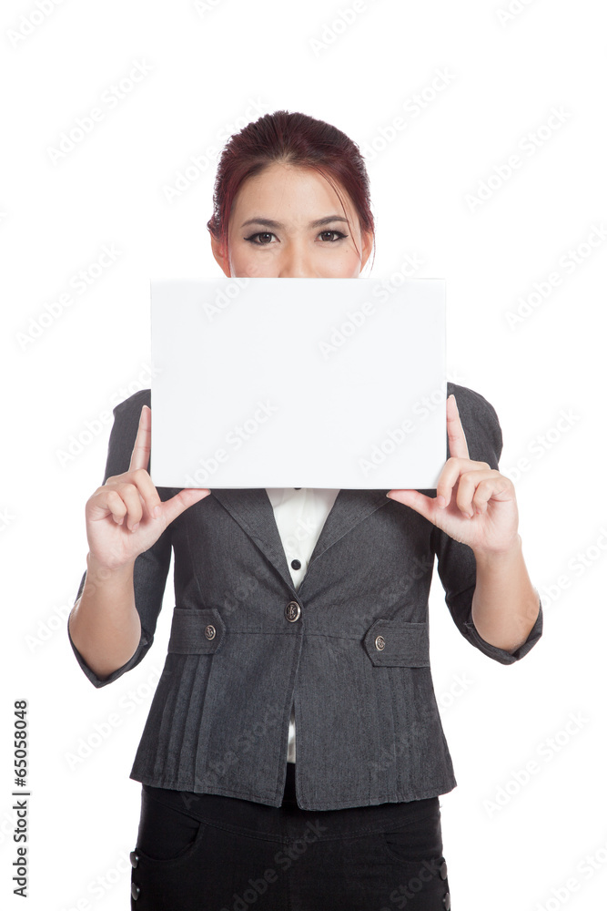 Asian businesswoman hold a blank sign close her lower face Asian businesswoman hold a blank sign close her lower face