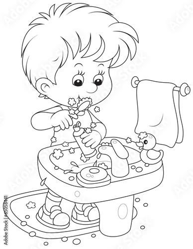 Child brushing his teeth