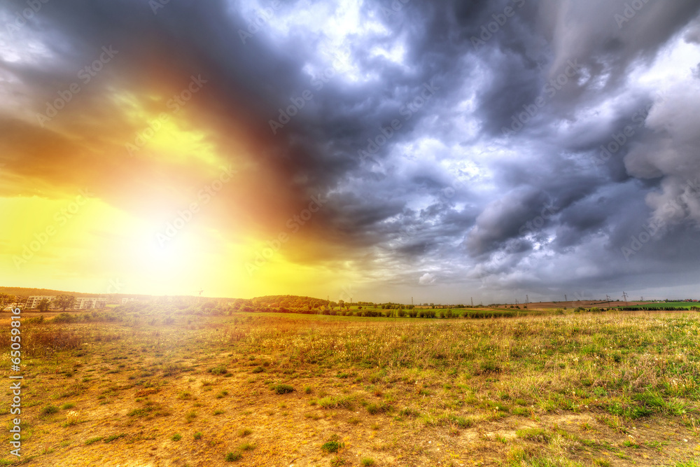 Cloudy sunset over the meadow in Poland Cloudy sunset over the meadow in Poland