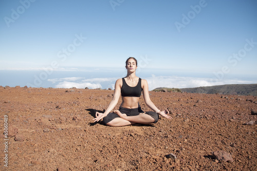 Young woman meditating in the nature