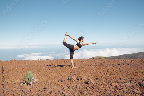Young woman doing yoga in the nature