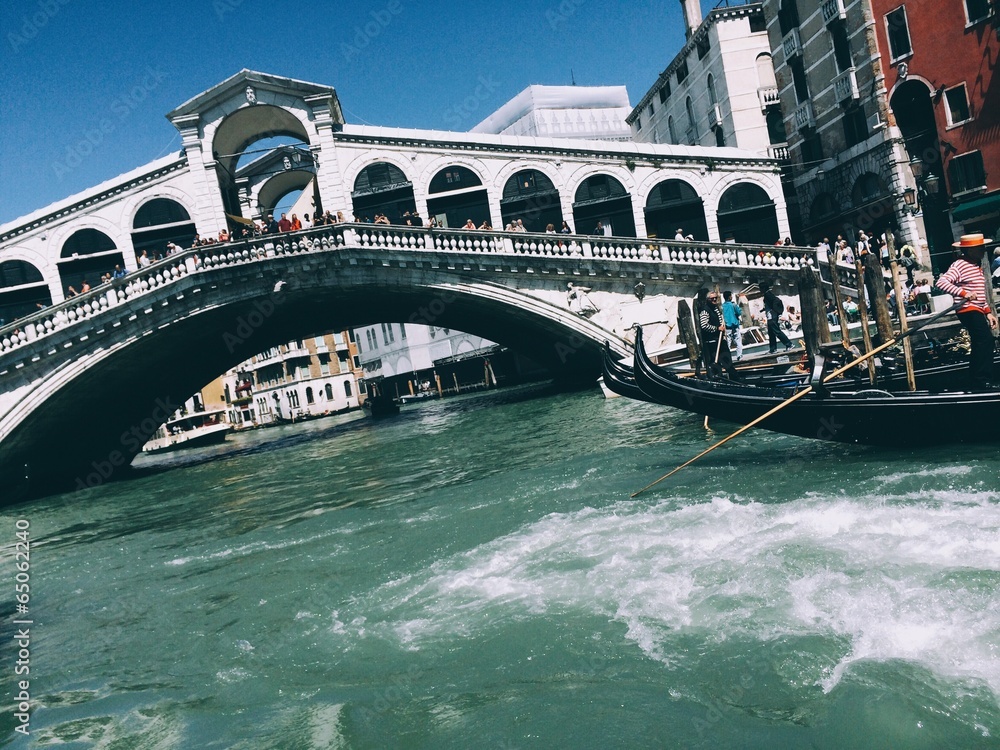 Venice, a beautiful gondola next to Rialto bridge