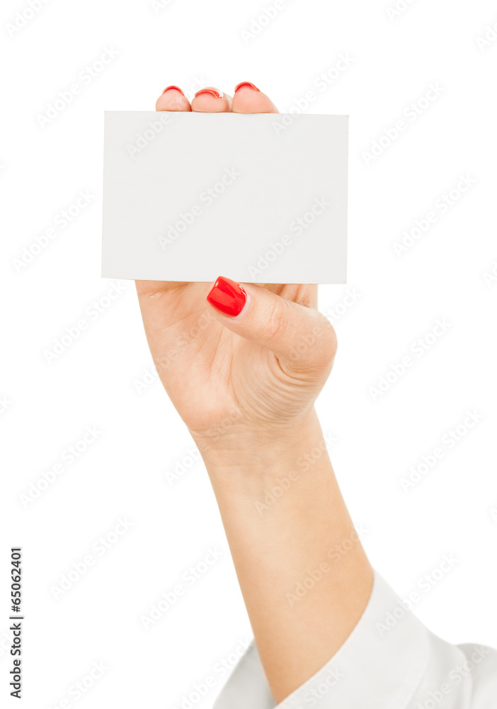 Female hand holding a blank business card Female hand holding a blank business card