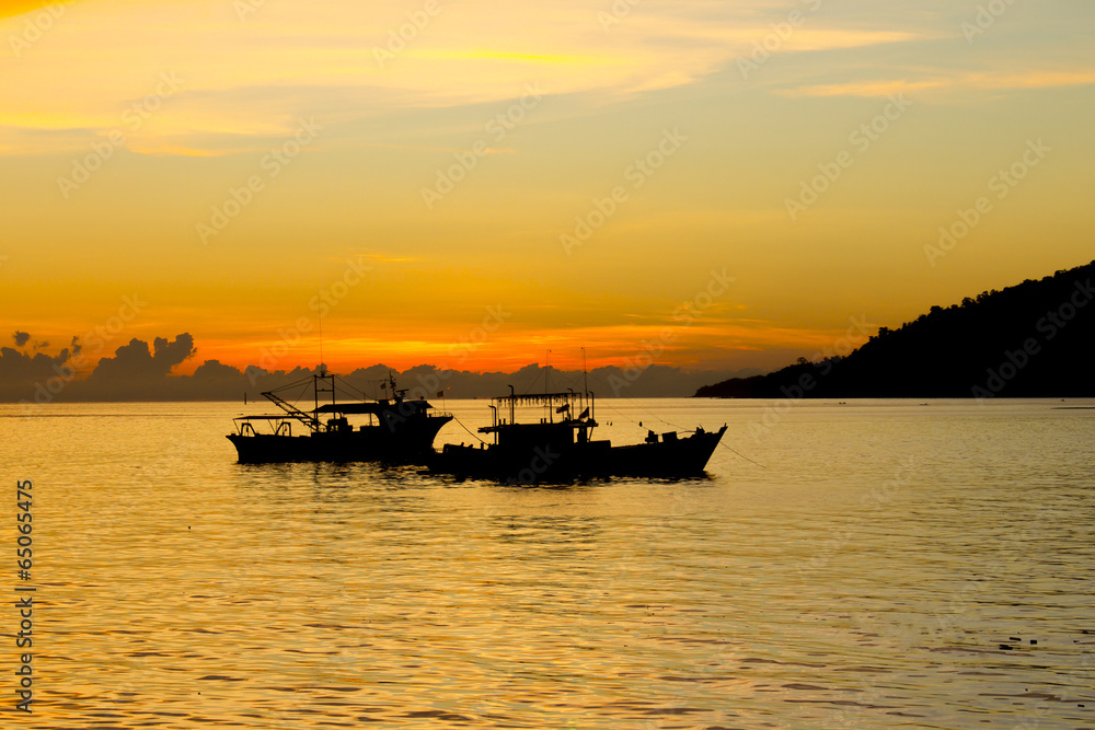 Fishing Boats on sea at sunset