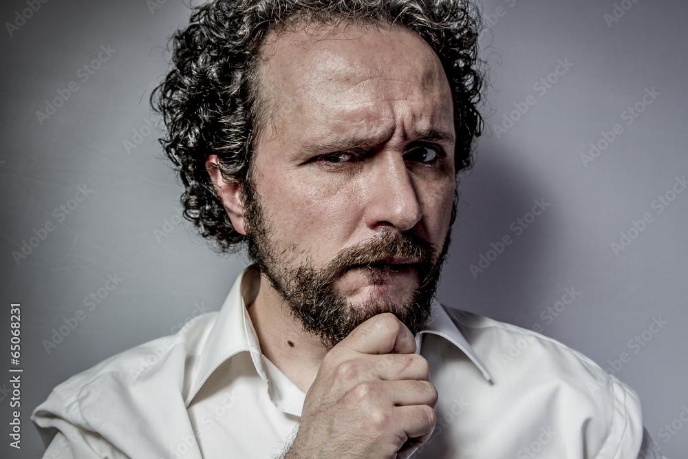 concern for the future, man with intense expression, white shirt concern for the future, man with intense expression, white shirt