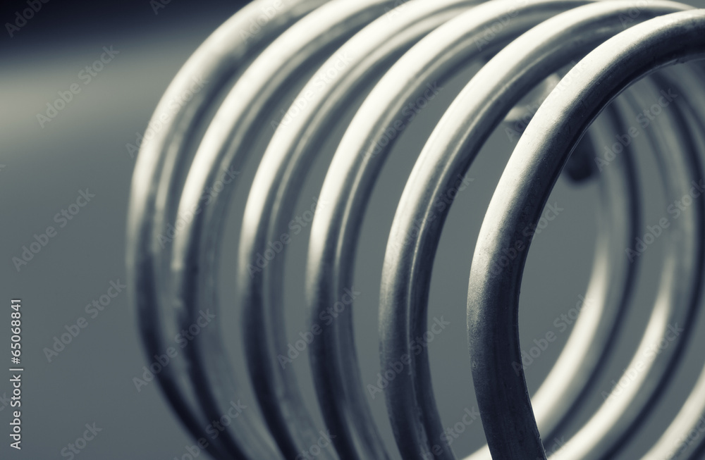 Aluminum spiral isolated on gray background Aluminum spiral isolated on gray background
