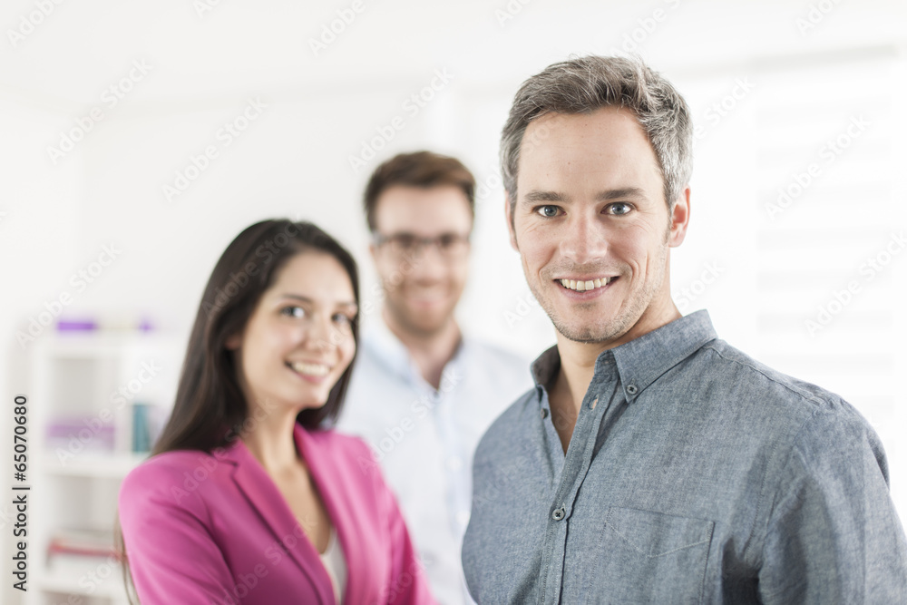 Portrait of a smiling senior businessman in the foreground Portrait of a smiling senior businessman in the foreground