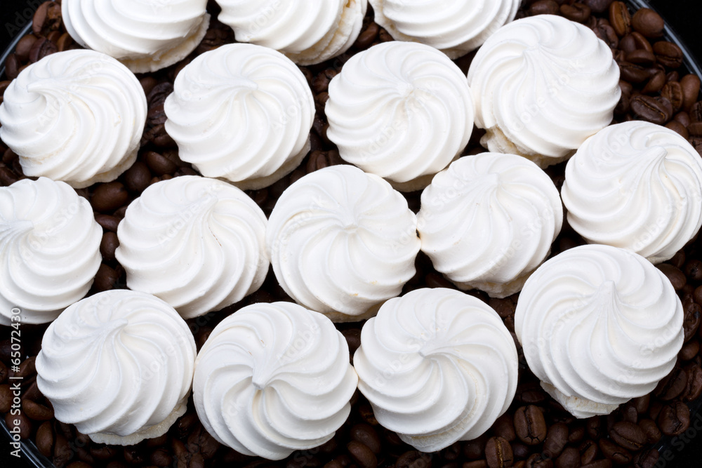 French vanilla meringue cookies and coffee beans French vanilla meringue cookies and coffee beans