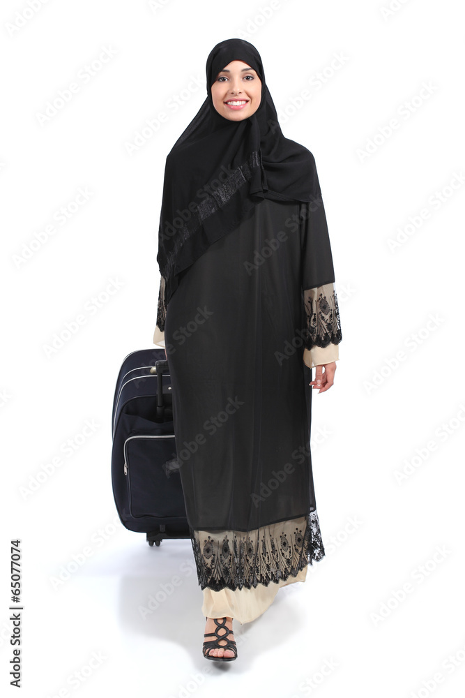 Full body of an arab saudi woman traveler walking Full body of an arab saudi woman traveler walking
