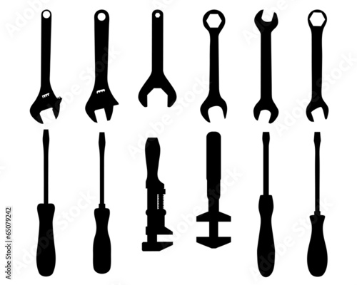 Black silhouettes of screwdriver and screw wrench, vector