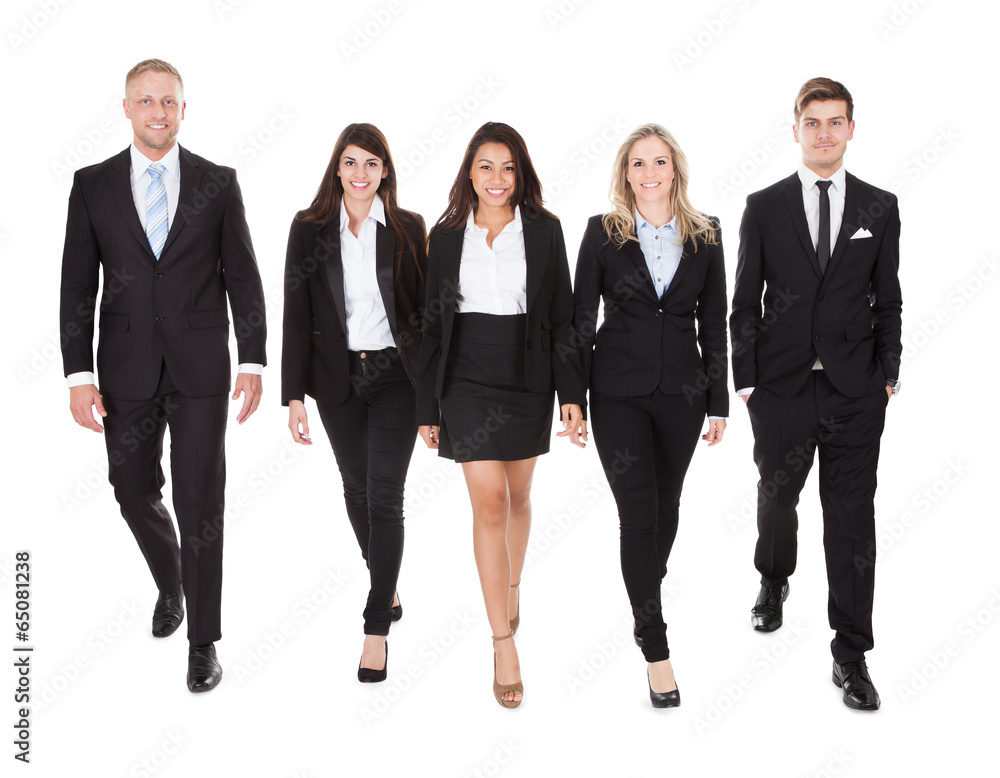 Portrait Of Welldressed Businesspeople Walking Portrait Of Welldressed Businesspeople Walking