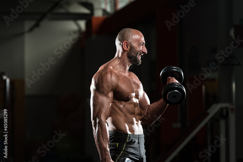 Mature Man Doing Exercise For Biceps