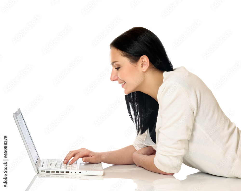 young business woman lying on the floor and working on a laptop young business woman lying on the floor and working on a laptop
