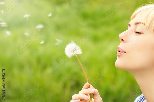 Woman with dandelion photo