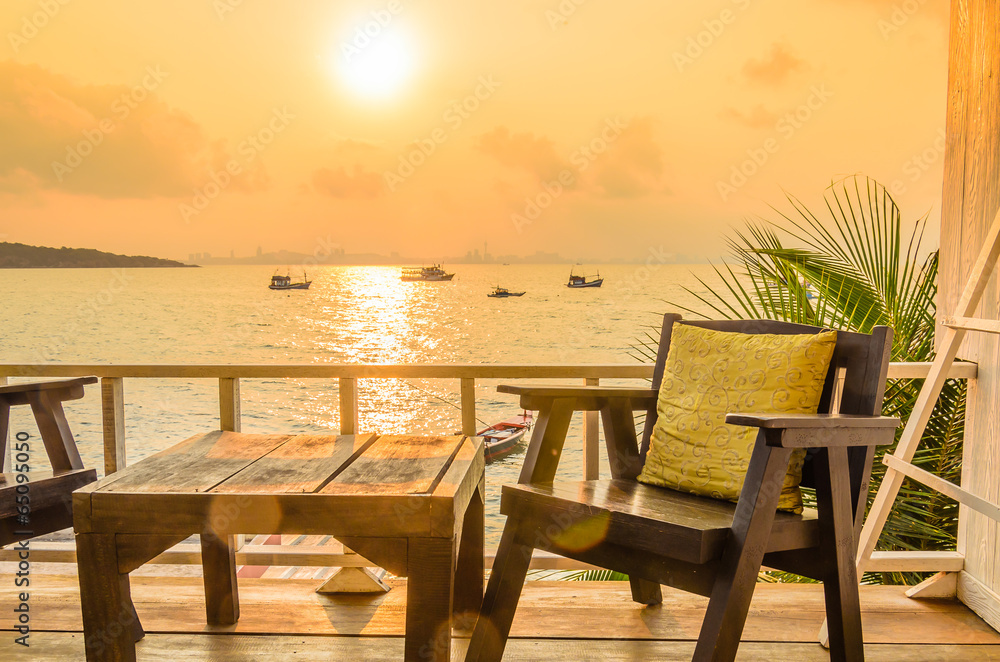 Wood chair sunset on the beach